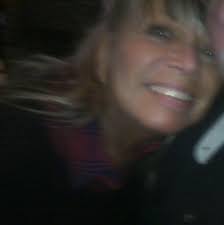 What brand of coffee does Origins Cafe use?