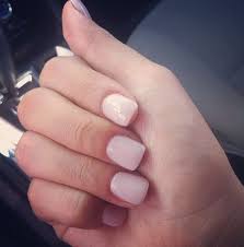 The technique involves literally dipping the nails into colored powder, while brushing on layers of bonder as an adhesive for the powder, before using a clear sealant on top. Square Pink Powder Acrylic Nails Novocom Top