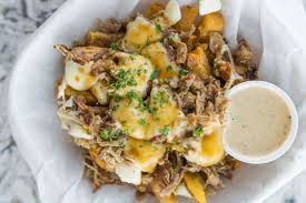 A dish consisting of french fries and fresh cheese curds topped with hot gravy. Best Poutine Las Vegas Restaurants Eater Vegas