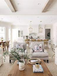 White is a vibrant and bright color with. Open Layout Living Room And Kitchen Benjamin Moore Classic Gray White Kitchen Wood Beams Br Farm House Living Room Open Living Room Design Open Living Room