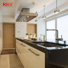 This countertop is made of tempered glass that offers an almost ethereal and light feeling in a kitchen where the countertop usually is made of a solid mass. Black And White Acrylic Solid Surface Stone Kitchen Countertops Kitchen Island Counter Tops Kkr Stone