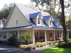 An attractive house is even more lovely when the owners are delightful; 32 Blue Metal Roof Ideas Metal Roof House Exterior Blue Roof