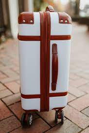 • hold in the button while you turn the dials to set your desired combination. Mark Graham Terminal 1 Suitcase Review Giveaway