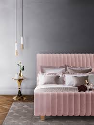 A small modern bedroom with a watercolor wall, a sleek white dresser. Cozy Modern Bedroom Designs That Will Be Your Haven This Winter