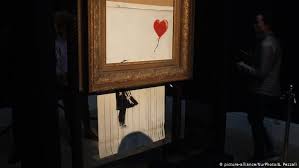 In a video posted after the incident, banksy shows how he built a custom. Banksy Video Says Balloon Girl Shredding Went Wrong News Dw 18 10 2018