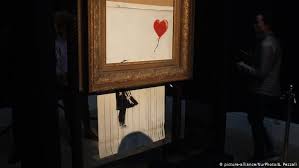 Purchaser of banksy painting that shredded itself plans to. Banksy Video Says Balloon Girl Shredding Went Wrong News Dw 18 10 2018