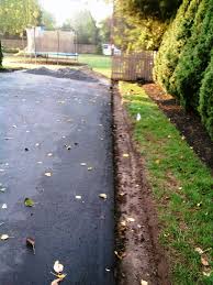 Driveway edging secures the pavers in place and creates a perimeter about 7 deep and 7 wide. Belgian Block And Pavers Dressing Up An Asphalt Driveway All About The House Asphalt Driveway Driveway Edging Driveway Landscaping