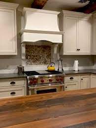 By installing a range hood you can catch the grease and smoke from the air around the stove. 30 Stone Range Hood Kitchens Ideas Stone Range Hood Range Hoods Range Hood