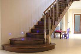 Stairs and a sofa in a bright. How To Maintain Indoor And Outdoor Wooden Staircases