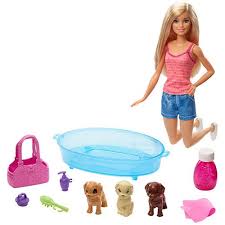 Pretty young woman in bathing suit is talking on mobile phone and drinking champagne while taking bath in spa salon. Barbie Puppy Bath Time Caucasian Doll Playset
