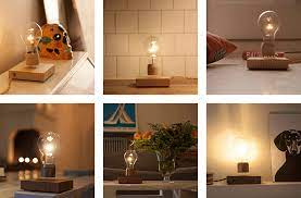 flyte is a led bulb which floats above its power source led light bulb levitation table lamp wood