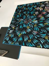 Edith Richards beautiful painting outside the Walkatjara Studio. All of the  paintings for sale are hand painted in the Walkatjara Studio by local  Anangu living in the Mutitjulu community, inside the national