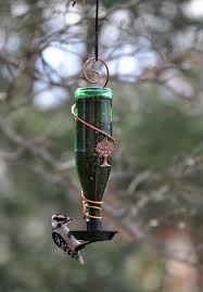 I chose white paint (shocker) and once everything was dry, i added the wine bottle with birdseed. 12 Diy Wine Bottle Bird Feeder Ideas Balcony Garden Web