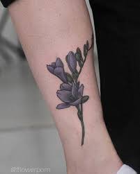 Realistic Freesia Tattoo Inked On The Left Calf Tattoos Floral Tattoo Shoulder Minimal Tattoo Design