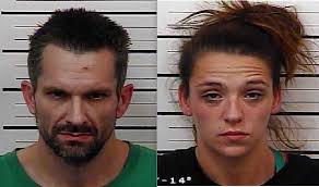 Couple accused of dragging man with car during robbery attempt