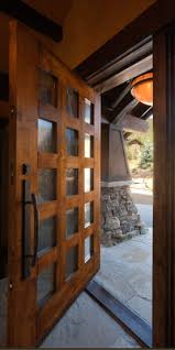 large rustic pivot entry door with bronze grip and deadbolt rustic entry doors door design main door design