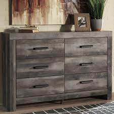 The rustic gray finish contrasts nicely with charcoal finish corner supports. Signature Design By Ashley Wynnlow Youth 6 Drawer Dresser In Rustic Gray Nebraska Furniture Mart