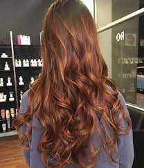 Woman With Curly Auburn Hair Hygge Trend Hair Color Auburn Light Auburn Hair Light Hair Color
