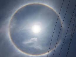 Halo, any of a wide range of atmospheric optical phenomena that result when the sun or moon shines through thin clouds composed of ice crystals. 22 Degree Sun Halo Seen In The Sky The Hindu