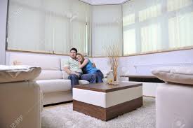 When space is at a premium, as it is for the apartment and city dwellers in your life, the best 2020 gifts do double duty. Happy Young Couple Relax At Home In Modern And Bright Living Room Stock Photo Picture And Royalty Free Image Image 13340239