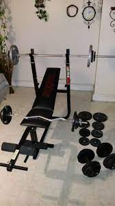 Weider ultra max weight bench w/ long bar weights, curl bar and dumbells  200 obo for Sale in Philadelphia, PA - OfferUp