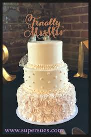 Delicate Ivory And Light Pink Three Tiered Wedding Cake Buttercream Roses And Pearls Wedding Cake Pearls Pink Wedding Cake Wedding Cake Decorations