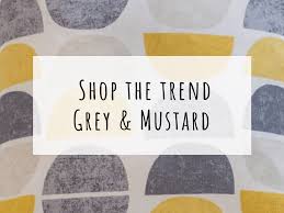 Gray/grey and yellow, pink, blue, green, purple. Shop The Trend A Grey And Mustard Living Room Nina S Apartment