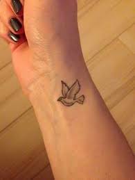 61 Small Dove Tattoos And Designs With Images Small Dove Tattoos Bird Tattoo Wrist Dove Tattoo Design For Women