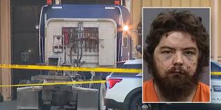 Florida police charge man with murder after crashing semi-truck into Tampa  strip club