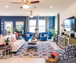 Create A Vibrant Living Room With Blue Armchairs A White Couch And Hints Of Red Decor Home Vibrant Living Room Living Room Red