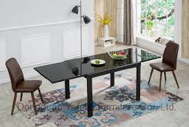 A n extension table is a great problem solver. Modern Factory Extension Black Oil Glass Metal Dining Table Set Furniture China Black Oil Glass Table Dining Table Set Made In China Com