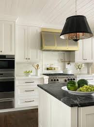 Black And White Marble Kitchen Countertops Well Appointed White And Gold Kitchen Features A Black Drum Light Pendant Hung From A Shiplap Ceilin In 2020 Marble Countertops Kitchen Kitchen Design Countertops Black Marble Countertops