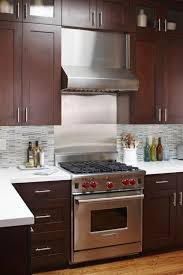 A Contemporary Small Kitchen Makeover Brown Kitchen Cabinets Contemporary Small Kitchens New Kitchen Cabinets