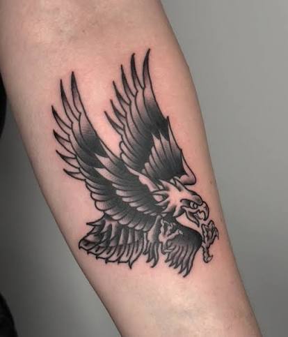 Eagle Tattoo by @klamanistattoo 🦅 A bold black and grey traditional tattoo of an eagle with wings spread wide, finished with strong shading and clean lines on the arm. now taking bookings
