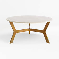 Supported by angled solid american walnut, rich brass details support the craftsmanship and beauty of real wood. Elke Round Marble Coffee Table With Brass Base Reviews Crate And Barrel