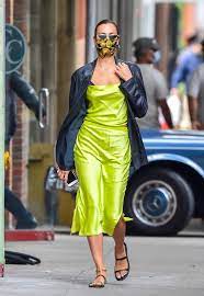 Irina shayk exudes sporty chic in all black as she jets out of new york with daughter lea who wears a cute pink mask. Irina Shayk Rocks A Neon Yellow Camisole In New York