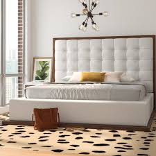 This low end platform bed has an attractive head panel finished in white with decorative castings and central brass star feature. Allmodern Hurst Tufted Low Profile Platform Bed Reviews Wayfair