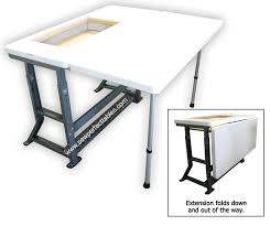 I used a ruler, pencil, drill and saw i owned to measure, and create a slot for the sewing machine to slide into. Sew Perfect Sewing Tables Extension Kit