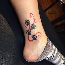 20 Amazing Paw Print Tattoos With Deep Connection Tattoos Win Pawprint Tattoo Print Tattoos Paw Print Tattoo