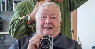Man snaps same mirror selfie at barber shop over 42 years