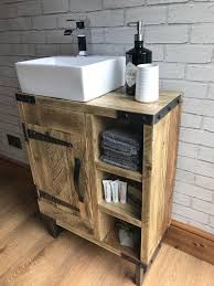 It features two metal sinks and a practical construction with six shelves and lower compartments with double wooden doors and decorative handles. Reclaimed Rustic Industrial Vanity Unit With Sink Etsy Industrial Vanity Reclaimed Bathroom Wooden Bathroom