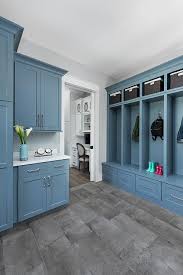 The gray darkens in the floor tiles. Blue Mudroom Lockers With Gray Floor Tiles Transitional Kitchen