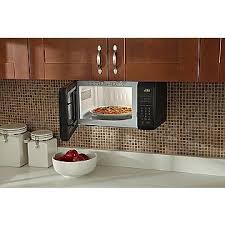 We wanted our microwave to be out of sight so we built a custom under counter cabinet for it with extra roof for cook book storage. Pin On Such A Homebody
