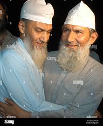 Ahmad Javed Khawaja, right, and his brother Ahmad Naveed Khawaja greet each  other after their release outside jail in Lahore, Pakistan