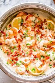The flavorful creamy wine sauce is enhanced with bits of pancetta, lemon zest, garlic and shallot, and you can feel good knowing that it's relatively low in calories and carbs compared to creamy alfredo pasta. Easy Garlic Shrimp With Bacon In Creamy Parmesan Sauce Diethood