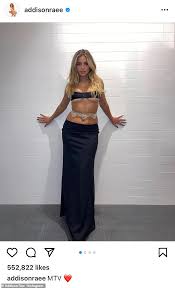 Addison Rae and Tanner Buchanan lock lips while presenting Best Kiss at the  MTV Movie & TV Awards