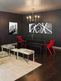 A red and black dining room can seem asian inspired or modern and chic, depending on your furniture and accessory choices, but you can also combine cultural and contemporary aspects for an eclectic mix of your own. Modern Gray Dining Room With Black Dining Table With Red Dining Chairs And Benches Hgtv
