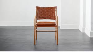 Below, four tapered metal legs provide support. Milford Dining Chair Reviews Cb2 Dining Chairs Dining Room Chairs Modern Modern Dining Chairs