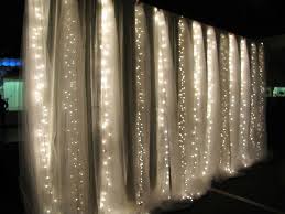 Decorate With White Lights This Waterfall Effect Created With Tulle And White Lights Would Be A Lights Wedding Decorations Twinkle Lights