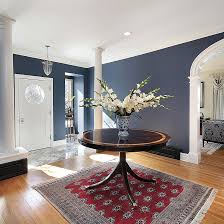 Inspiration for a timeless dark wood floor and brown floor entryway remodel in new york with a dark wood front door and beige walls love the floors and walls. 10 Foyer Design Ideas For Beautiful Home Entrance Design Cafe